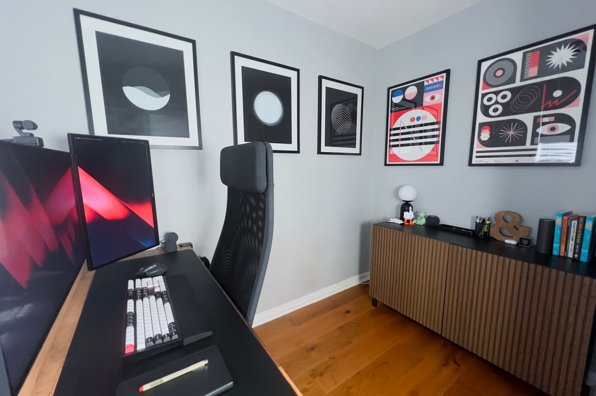 Shane's desk setup showing MacBook Pro, dual monitors and clean workspace